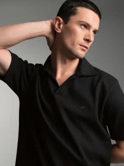 Oversized Poloshirt ohne Knopfleiste in Waffeloptik Schwarz