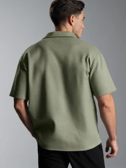 Oversized Poloshirt ohne Knopfleiste in Waffeloptik Salbei